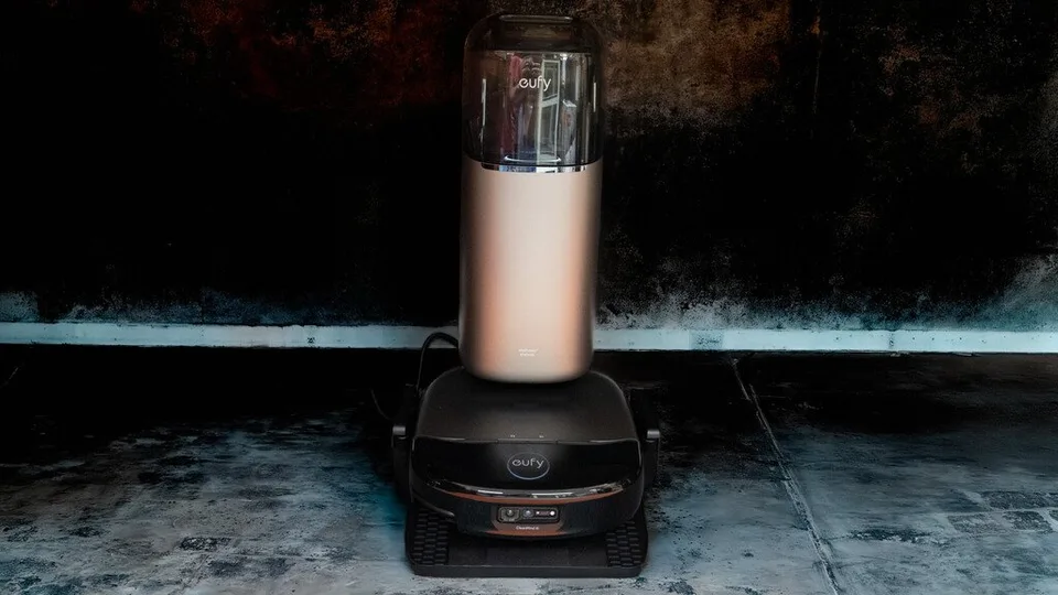 Eufy robot vacuum docked at its charging and cleaning station.